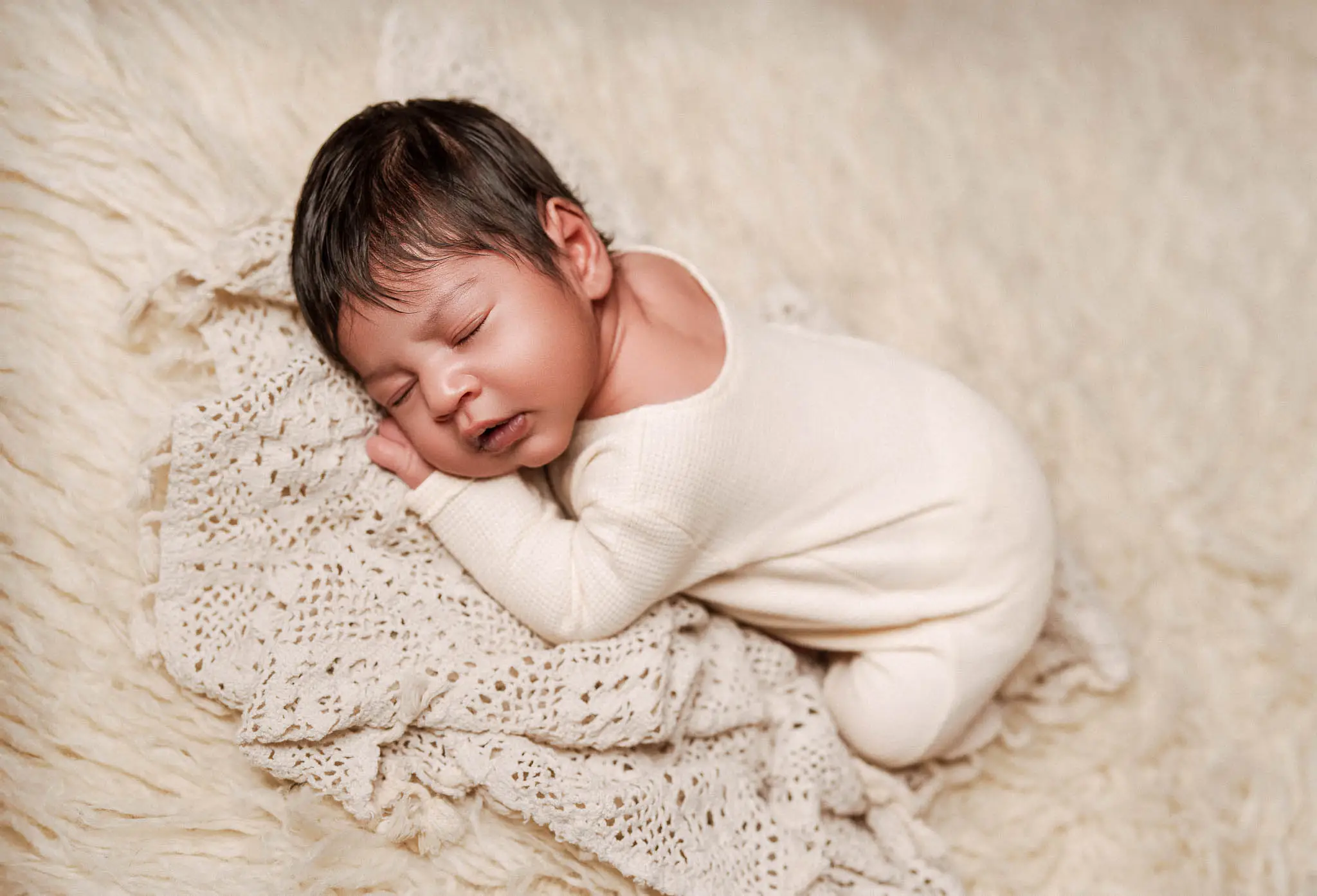 Studio-style newborn portrait created during a home session