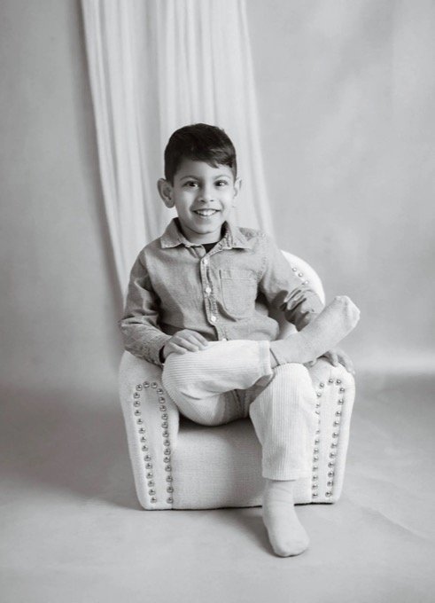 Black and white family photography at home with child portrait