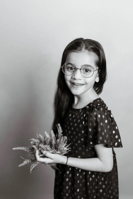 Relaxed black and white child portrait at home